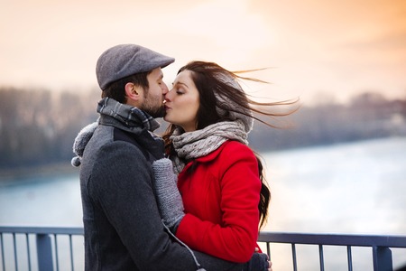 Couple Kissing by the Water